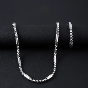 Polished stainless steel jewelry set with box chain and cylindrical textured links