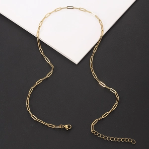 Detail of gold paperclip link chain with secure lobster clasp and extension