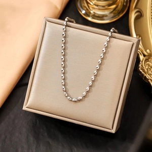 Elegant silver stainless steel beaded ball chain necklace displayed on a jewelry gift box