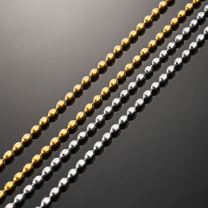 Polished 18K gold and silver plated stainless steel bead chains in close-up detail