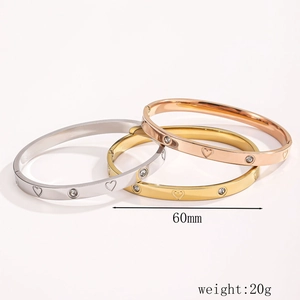 Three-color stainless steel heart bangles in gold, silver, and rose gold with rhinestones