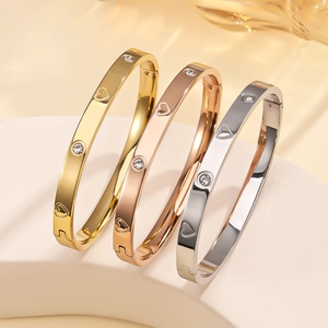 Three-piece stainless steel heart bracelets in gold, rose gold, and silver finishes