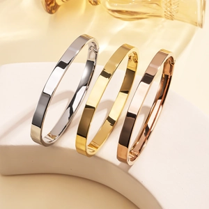 Polished 6mm stainless steel bangles in silver, gold, and rose gold finishes