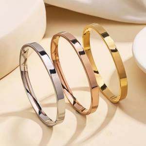 Three-piece polished 18K gold plated stainless steel 6mm bangles in silver rose gold and gold