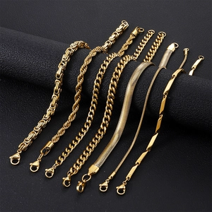 Set of seven gold plated stainless steel bracelets including Cuban and snake chains