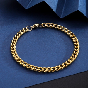 Detailed macro view of 18K gold plated Cuban link chain with a lobster clasp