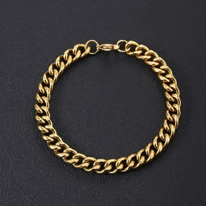 Close-up of polished 18K gold-plated stainless steel Cuban link bracelet with lobster clasp
