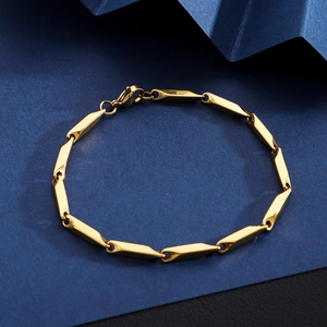 Close-up of a 18K gold-plated stainless steel chain with polished geometric links and lobster clasp