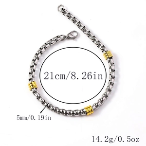 Detailed view of two-tone stainless steel box chain bracelet showing 21cm length and 5mm width