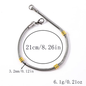 Detailed view of silver stainless steel snake chain with gold ring accents and lobster clasp