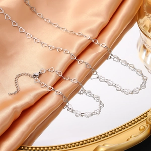 Detailed silver heart-shaped chain links with lobster clasp and adjustable extension