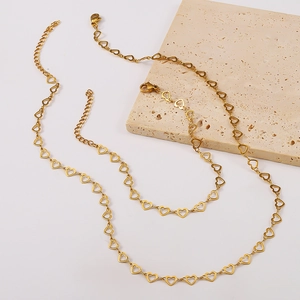 Detail of 18K gold plated hollow heart links necklace with adjustable lobster clasp closure