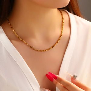 18K gold plated stainless steel box chain necklace worn on a female model with V-neck shirt