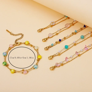 Gold plated stainless steel bracelet with natural stones and adjustable chain length