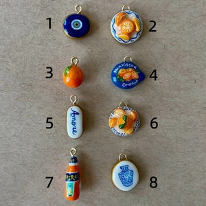 Collection of eight colorful gourmet food art pendants with 18k gold plated metal loops