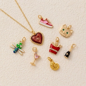 Mix of colorful enamel heart, sneaker, and animal charms with gold plated finish