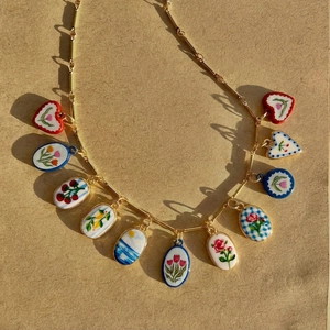 Gold chain necklace with floral ceramic pendants in vintage French country style