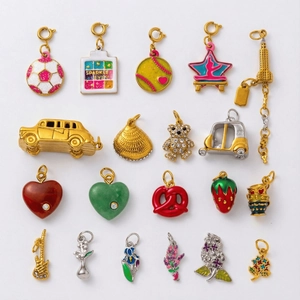 Assorted 18K gold plated stainless steel charms including pink makeup palette and sports icons
