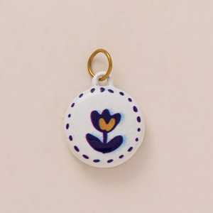 Artistic round ceramic pendant with hand-painted purple floral design and golden ring hook
