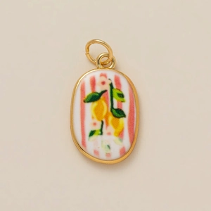 Oval ceramic pendant with pink stripes and lemon pattern in a gold-plated metal frame