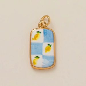 Golden rectangular pendant with blue and white checkerboard pattern and yellow lemons