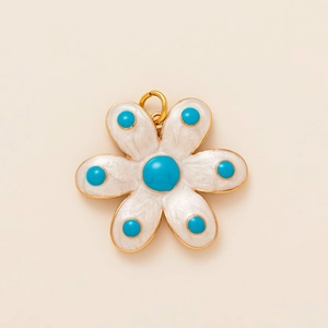 Charming 14k gold-plated floral pendant featuring white petals and blue turquoise-style beads