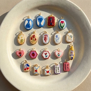 Set of 18 colorful enamel lobster charms in heart and oval shapes for DIY jewelry making