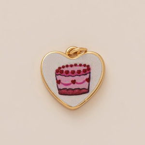 Golden heart pendant with cute pink cake illustration and sturdy metal hanging loop