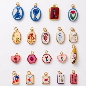 Assorted creative hand-painted ceramic pendants with nature motifs and metal clasps