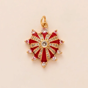 Star-shaped gold pendant with red enamel inlay and sparkling white cubic zirconia stones