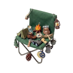 18K gold plated camping charms set featuring tent, bonfire, and compass on a green chair