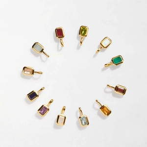 Collection of 12 colorful rectangle birthstone pendants in gold plated settings