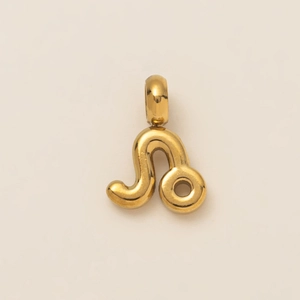 Detailed view of the gold Leo zodiac symbol pendant with polished metallic finish