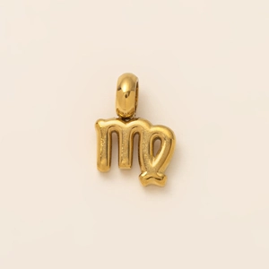 Detailed close-up of a gold-plated Virgo zodiac symbol pendant with a polished finish