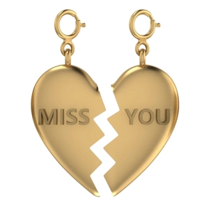 Detail of 18K gold-plated heart puzzle pendants with embossed Miss You lettering