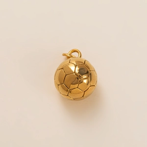 Detailed view of a 3D soccer ball pendant in 18k gold finish with polished metal texture