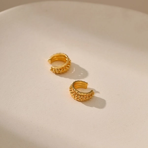 Detail view of 18K gold plated brass ear cuffs with multi-layer beaded and rope textures