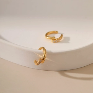 Detail of 18K gold plated brass ear cuff with micro-pave cubic zirconia accents