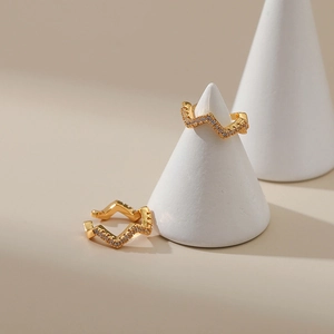 Detail view of 18K gold plated ear cuff with zigzag design and micro-set zircon stones