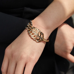 Modern leaf shaped open cuff bracelet with sparkling pavé crystals in rose gold finish