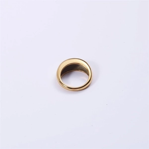 Top view of a chunky gold stainless steel ring with a polished domed surface and minimalist design