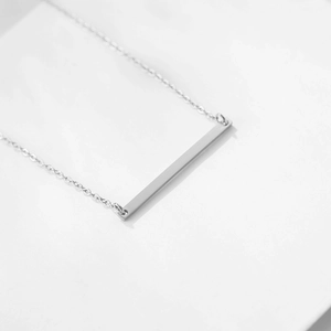 Polished silver stainless steel horizontal bar pendant necklace on a delicate chain