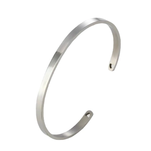 Polished 18k gold plated stainless steel cuff bracelet with heart cutouts on ends