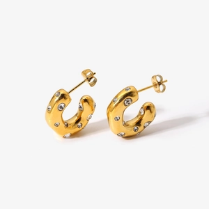 Detailed view of 18K gold plated stainless steel C-hoops with sparkling zircon stones