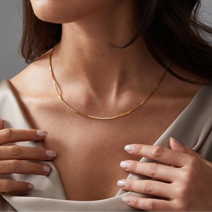 Minimalist gold box chain necklace shown on a model for daily luxury fashion