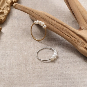 Elegant 18K gold and silver stainless steel rings featuring five natural freshwater pearls