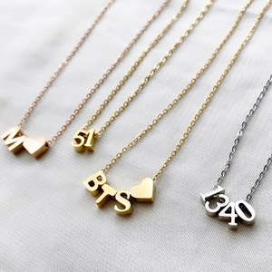 Minimalist stainless steel necklaces featuring M-heart, BTS-heart, and 51-1340 numeric pendants