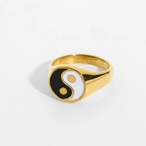 Macro shot of gold stainless steel signet ring featuring black and white Tai Chi Yin Yang symbol
