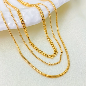 Minimalist multi-layered gold plated titanium steel necklaces set with diverse chain textures
