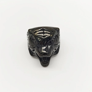 Macro shot of detailed tiger head ring in oxidized black metal with punk style aesthetics